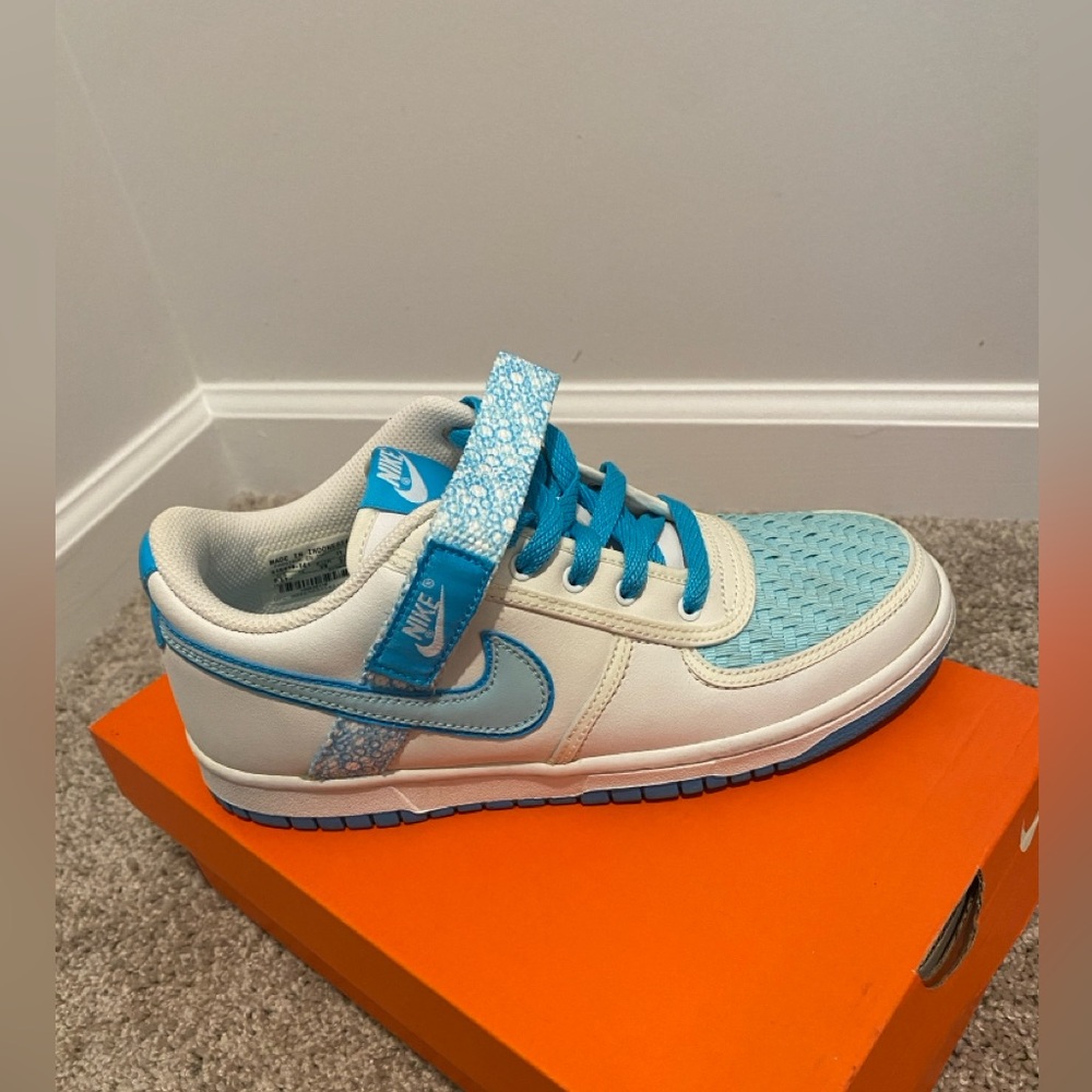 Laced up Nikes w/a strap